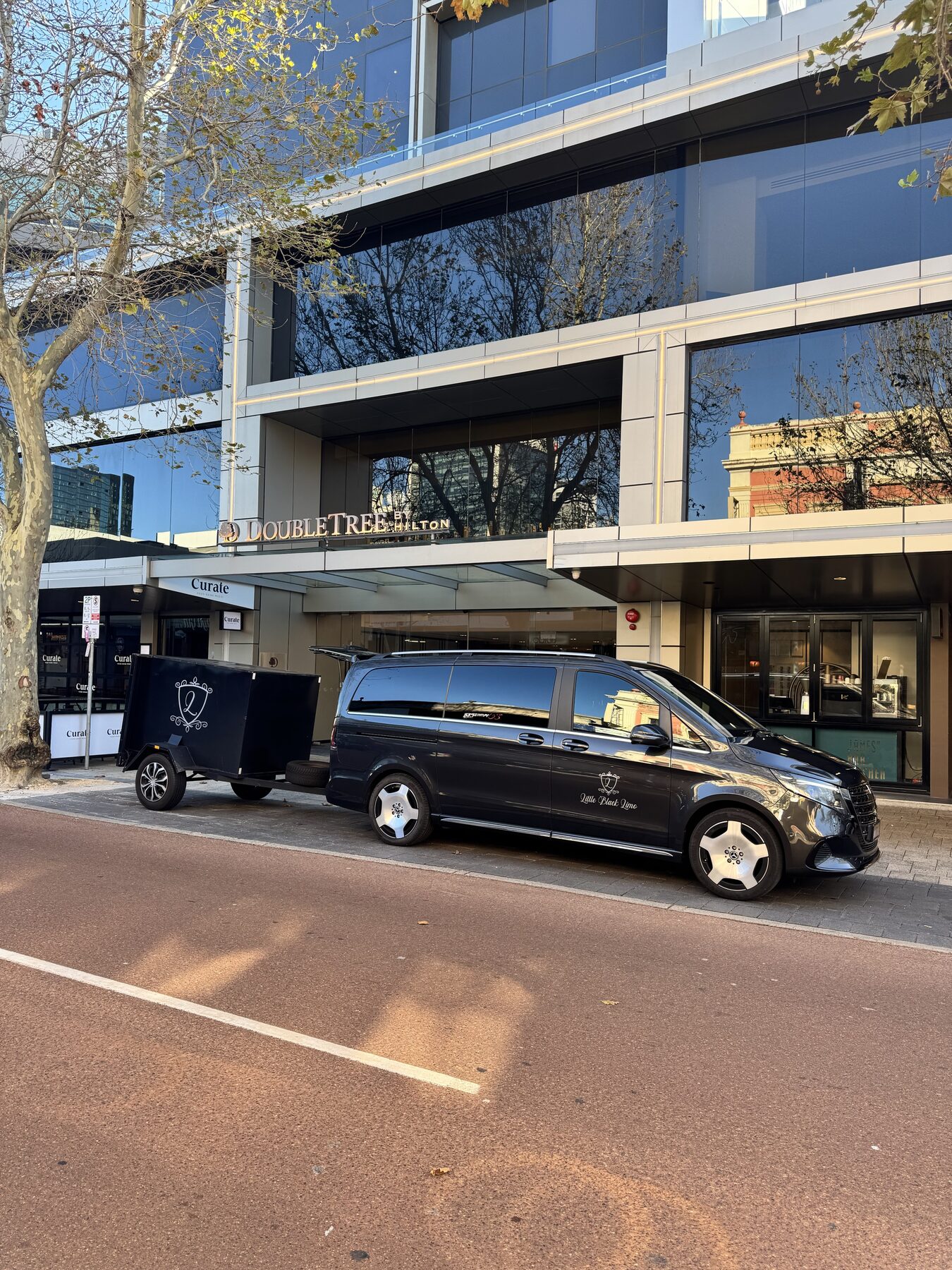 Little Black Limo van with luggage trailer