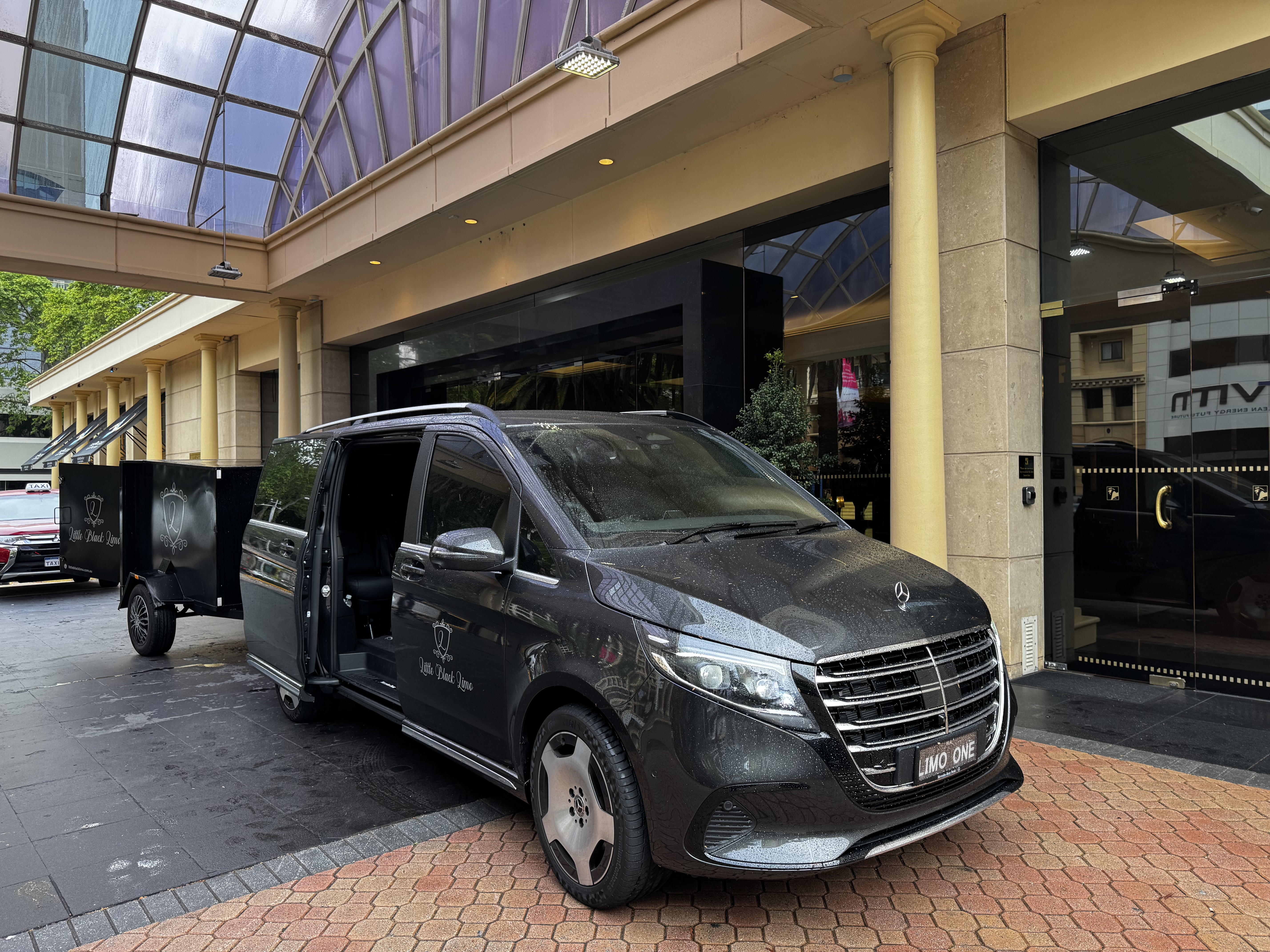 Little Black Limo van with luggage trailer