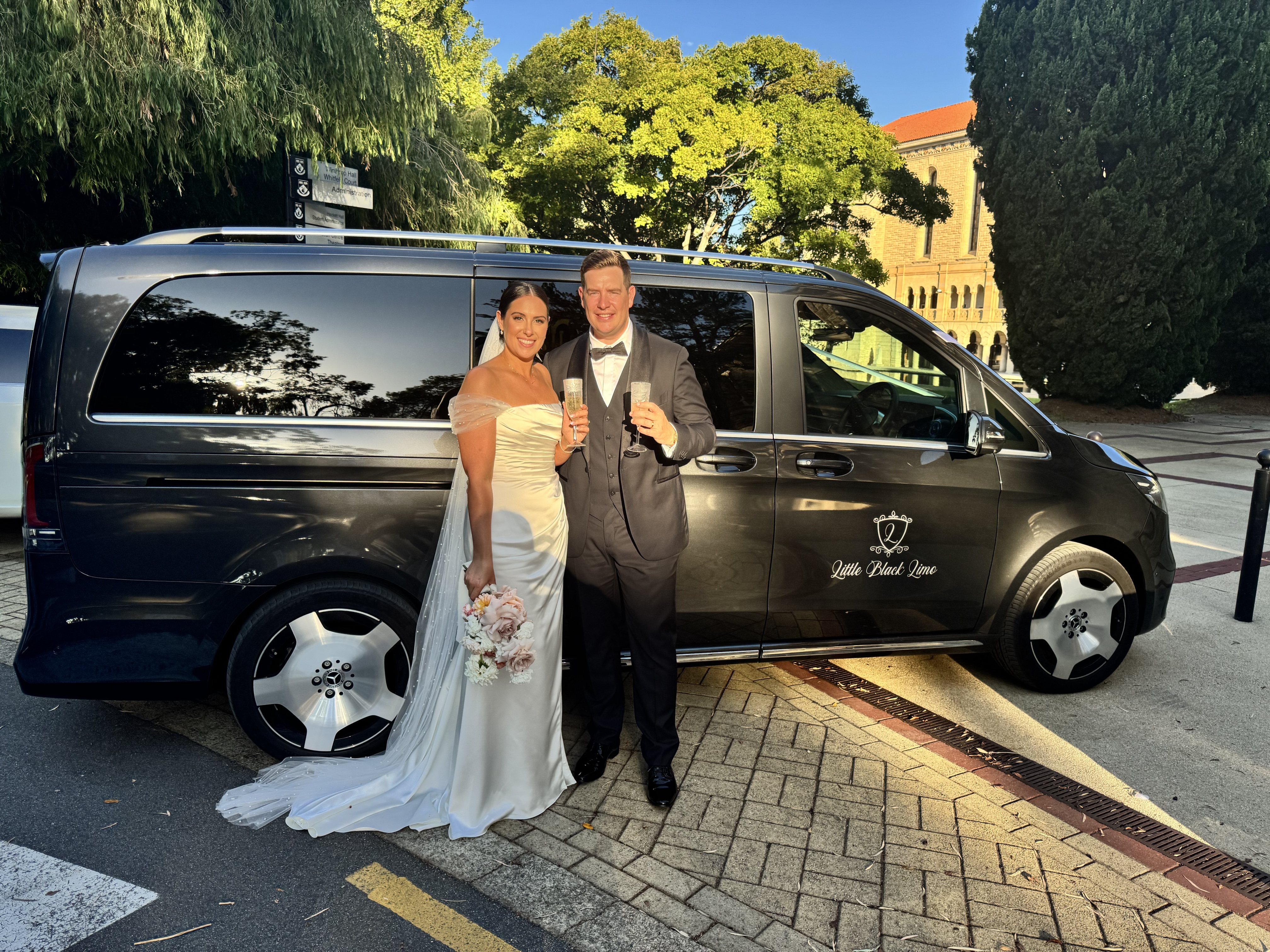 Group celebrating with champagne in the limo