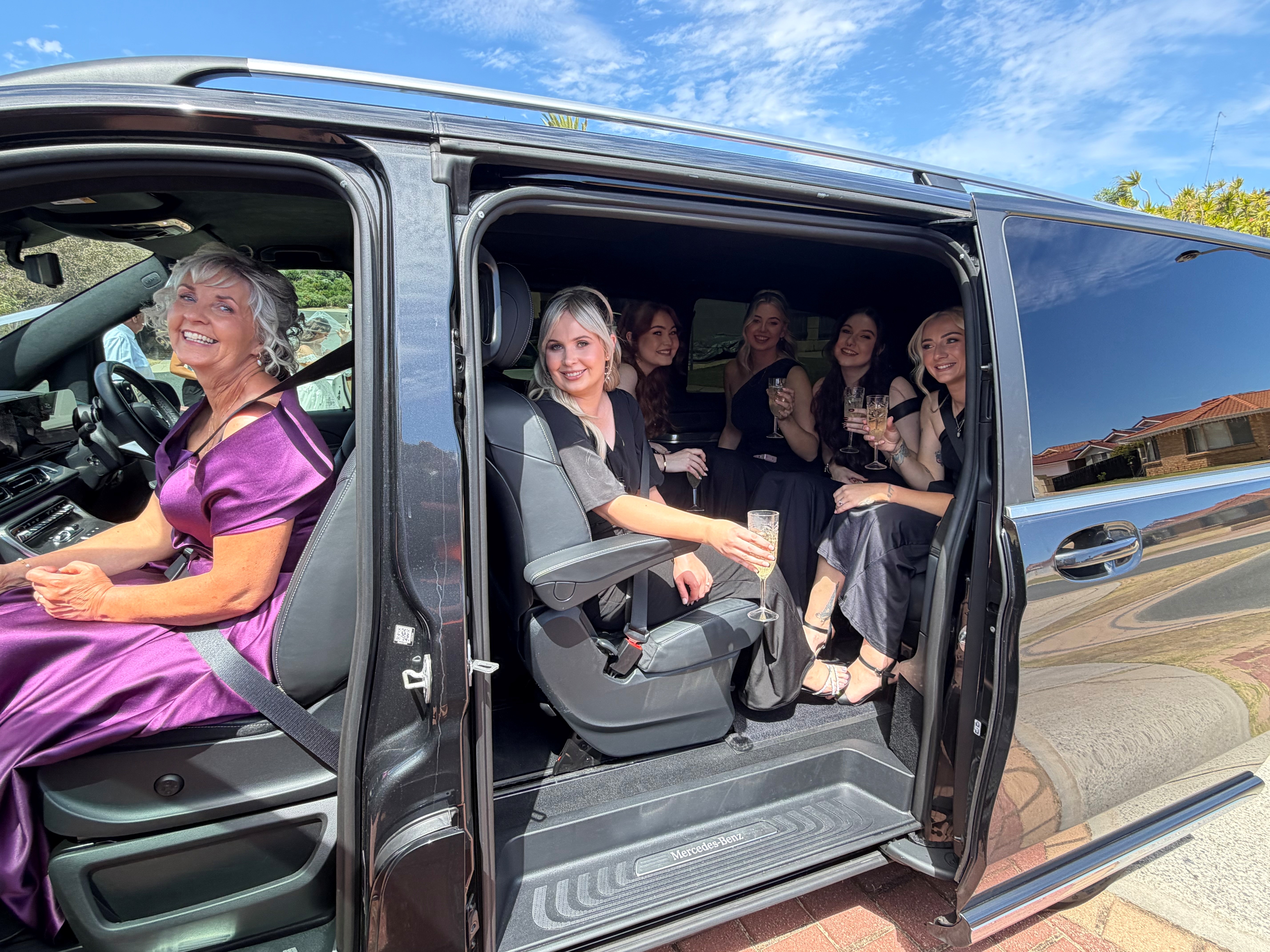 Guests toasting in the van doorway